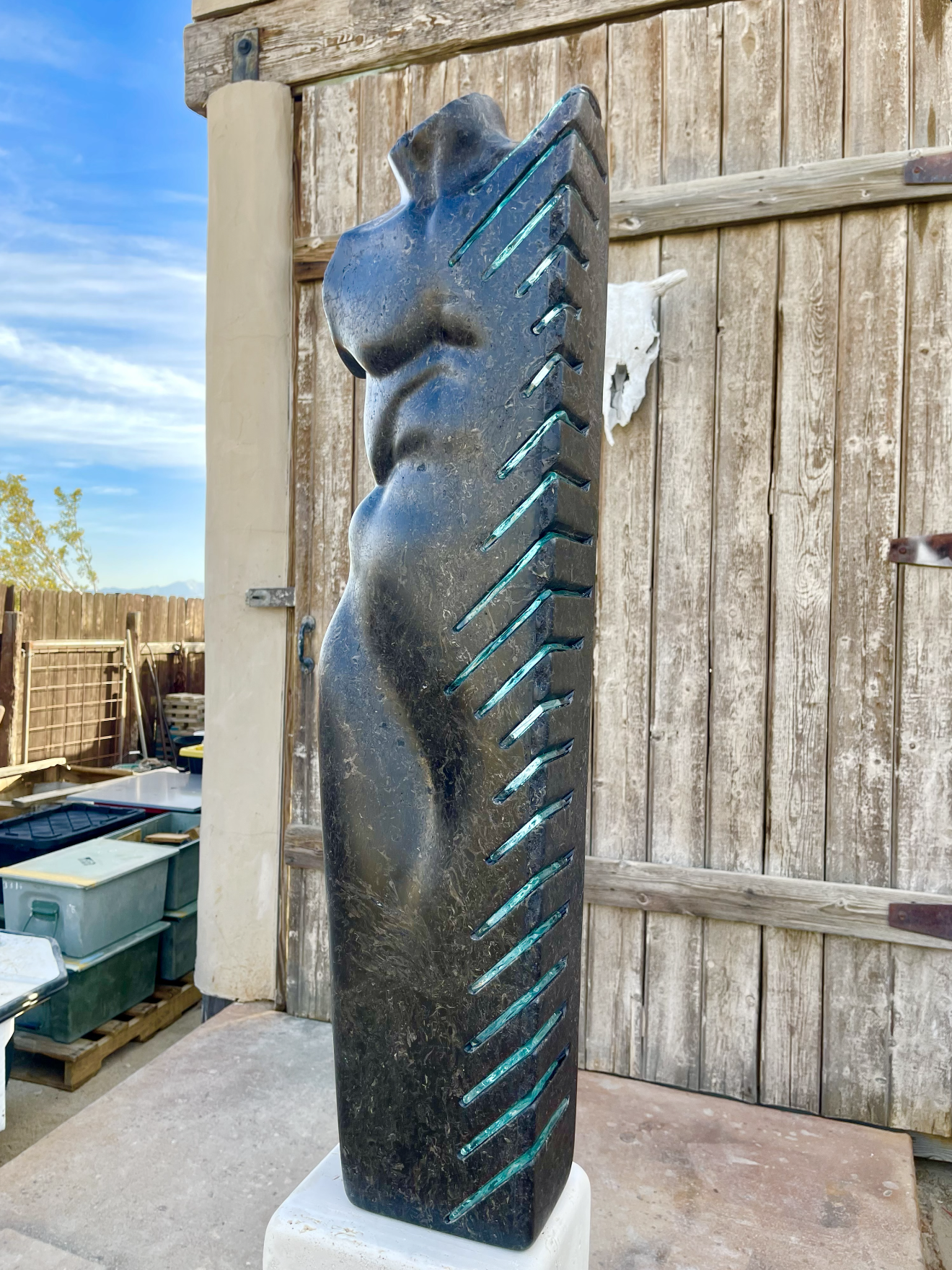 Figurative stone and glass torso sculpture by David Falossi